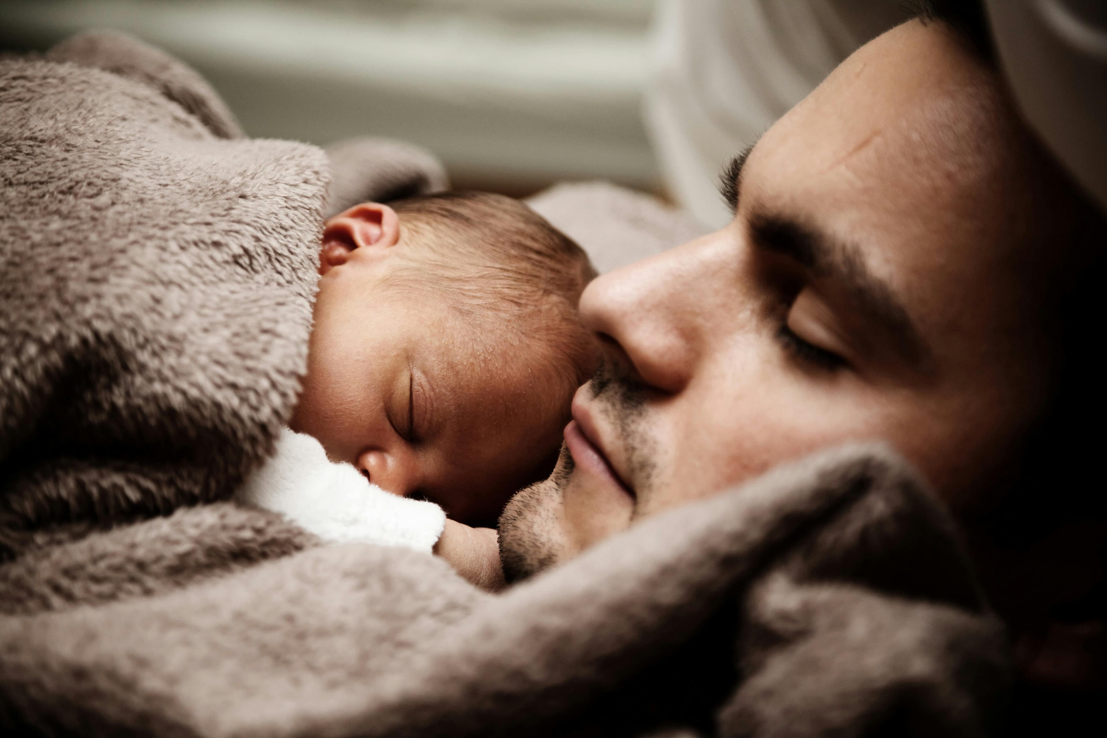 A warm family moment at dusk—hands intertwined and smiling eyes.